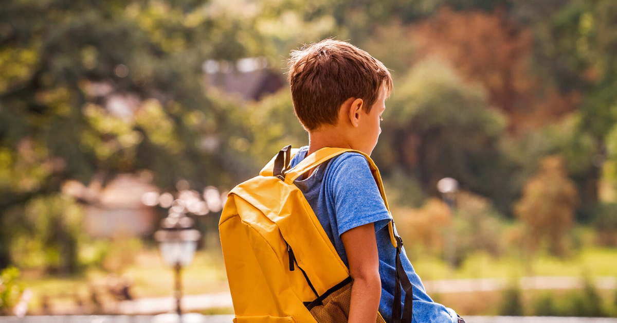 Image of student with backpack outside