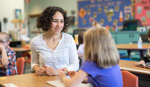 special education teacher talking to student